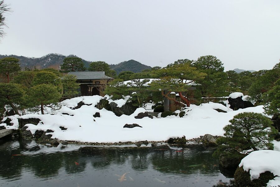 The raked gravel dry garden section of the Adachi Museum with perfectly pruned pines