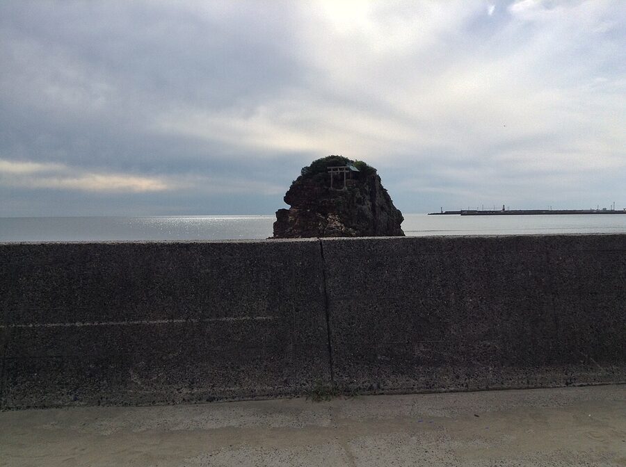 Bentenjima rock at Inasa Beach seen from the road