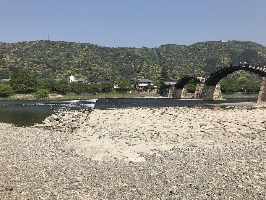 Aerial view with Iwakuni Castle on the hill, the Kintaikyo Bridge, and the Nishiki River