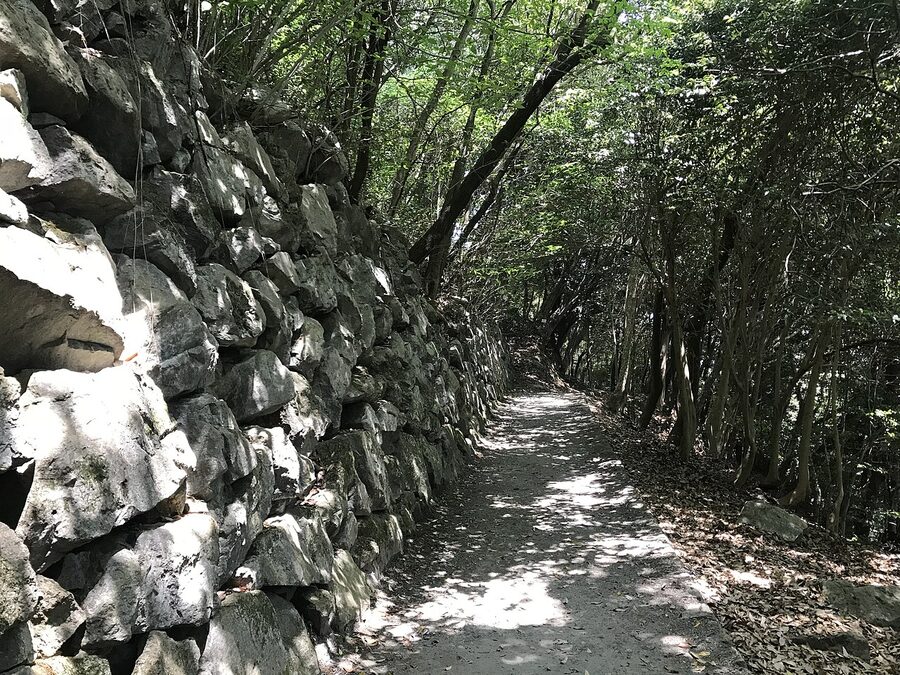 The preserved Edo-period stone wall at the base of Iwakuni Castle