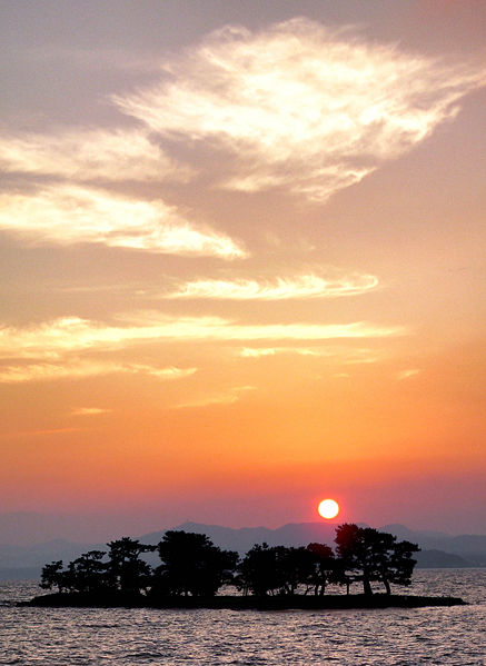 Sunset over Lake Shinji in Matsue with silhouetted hills