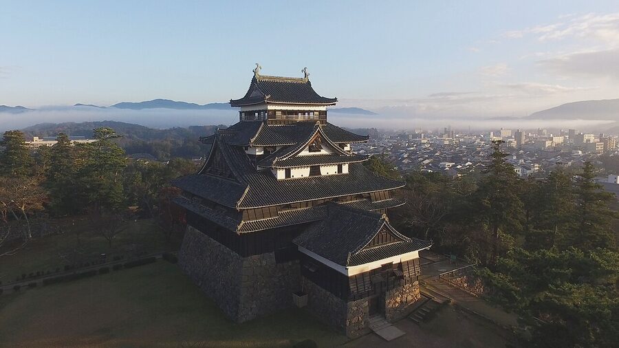 Matsue Castle's black-walled original keep rising from the stone base
