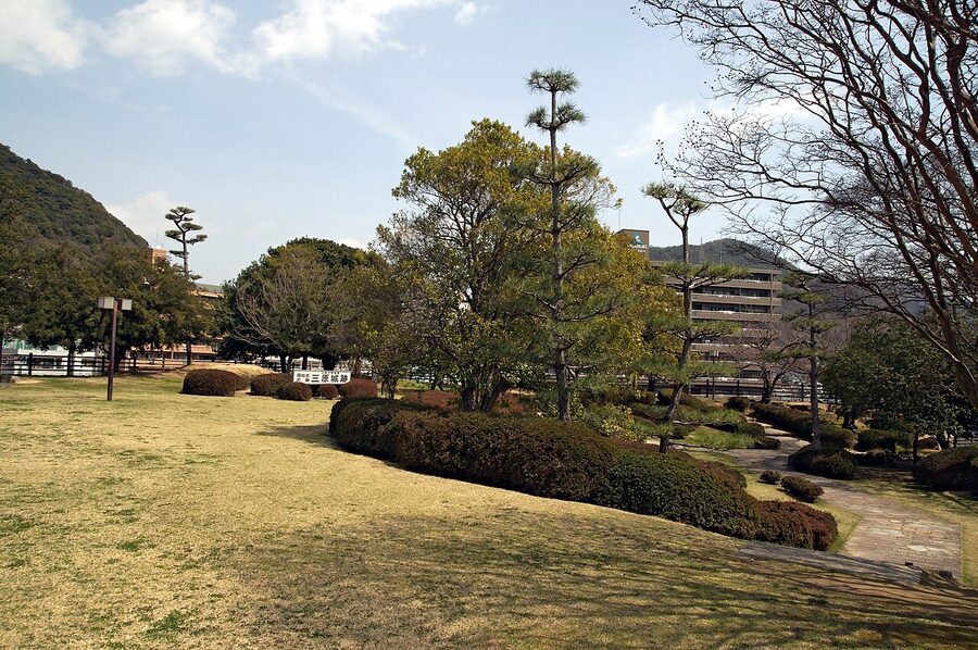 Stone ramparts of Mihara Castle ruins with the water-filled moat
