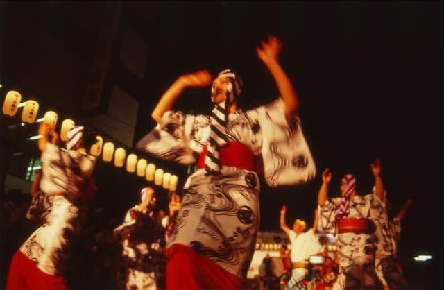 Dancers in happi coats performing the Yassa step at Mihara's summer festival
