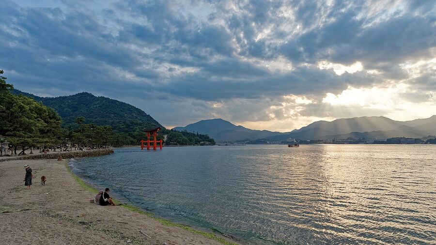 Sunset silhouette of the Miyajima coastline with islands in the distance