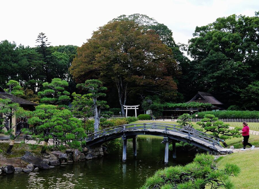 A wooden pavilion and winding path at Okayama Korakuen