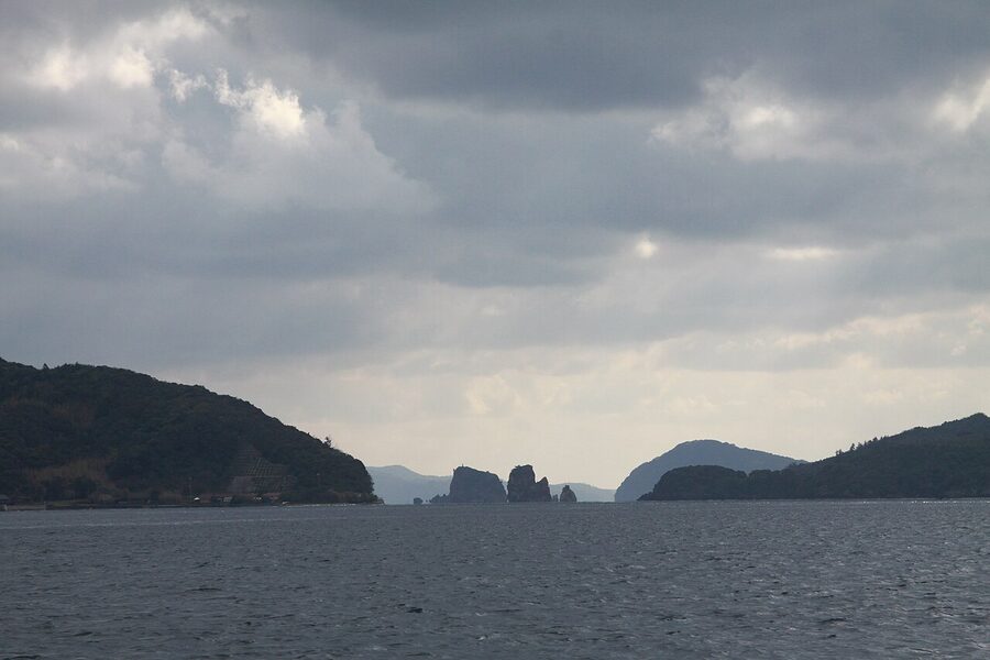 View from a ferry between the Oki Islands with a rocky island visible in the distance