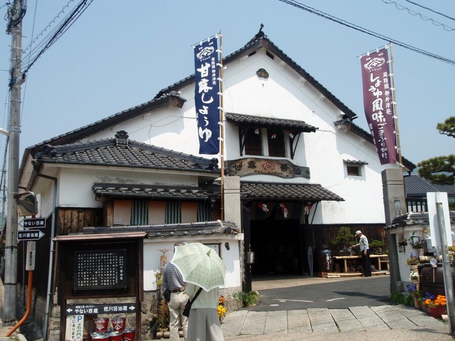 A traditional soy sauce storehouse in Yanai with wooden barrels visible