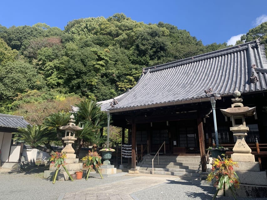 From Hiroshima: Rabbit Island and Takehara Town Tour - The small statue with a local wish