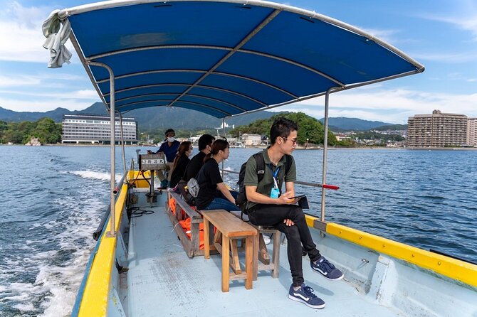 Miyajima Guided Tour and Fresh Oyster Farm Tour - Cruising past the Great Torii and oyster rafts